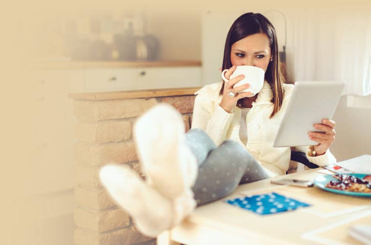 A woman enjoys a beverage in a safe home